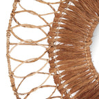 Gros plan sur les boucles tressées et les fibres du miroir Montezuma