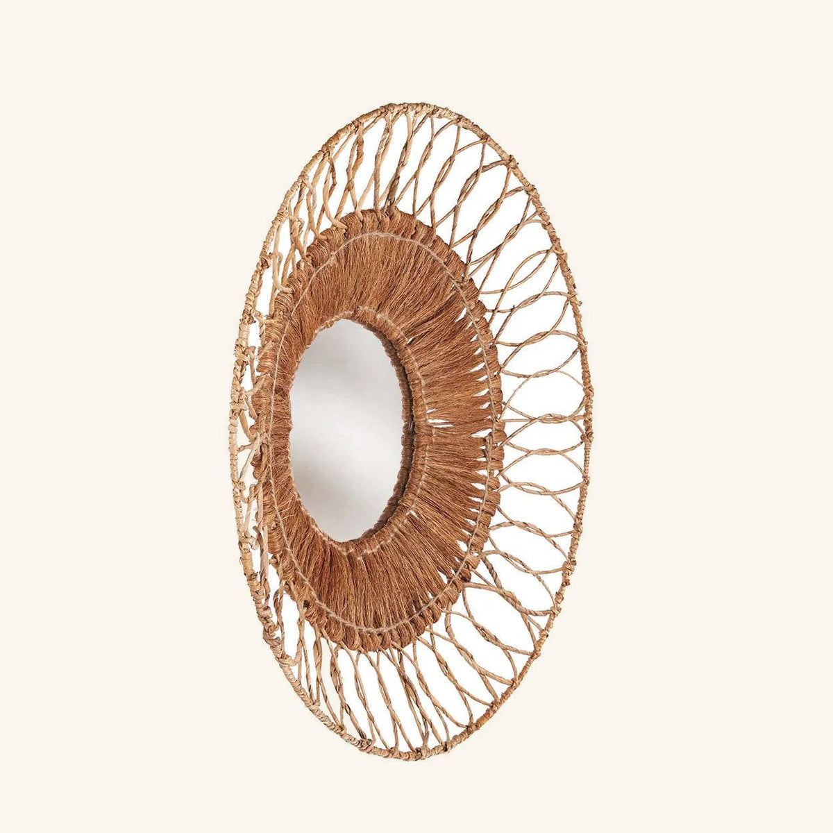 Miroir Montezuma vu de trois quarts, couronne de boucles ajourée